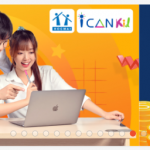 Two people looking at a computer Description automatically generated with medium confidence